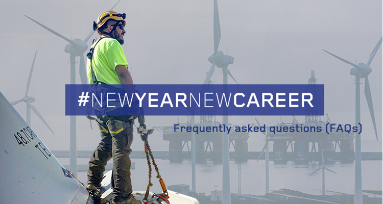 A worker wearing safety gear stands on a wind turbine with a backdrop of more turbines and industrial structures. Overlay text reads 